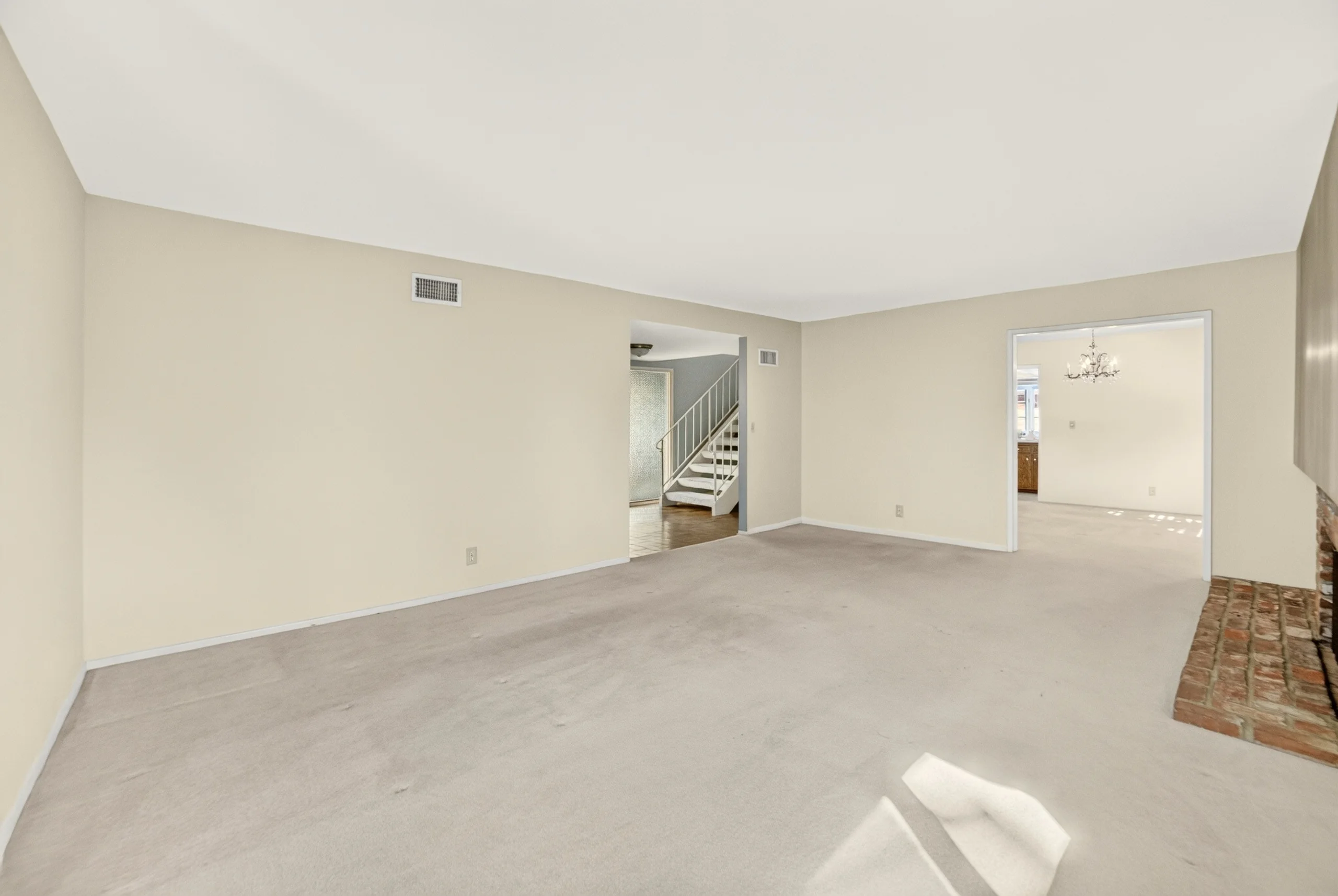 Living room as photographed, unfurnished